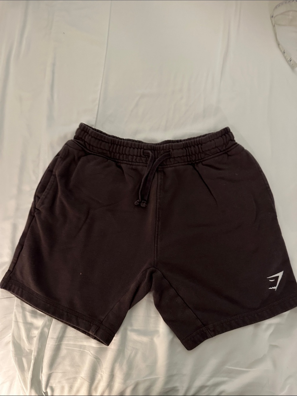 Gymshark black shorts with drawstring and 2 front pockets and one rear pocket